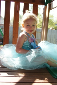 Ava wearing the Music Box ballerina dress in blue